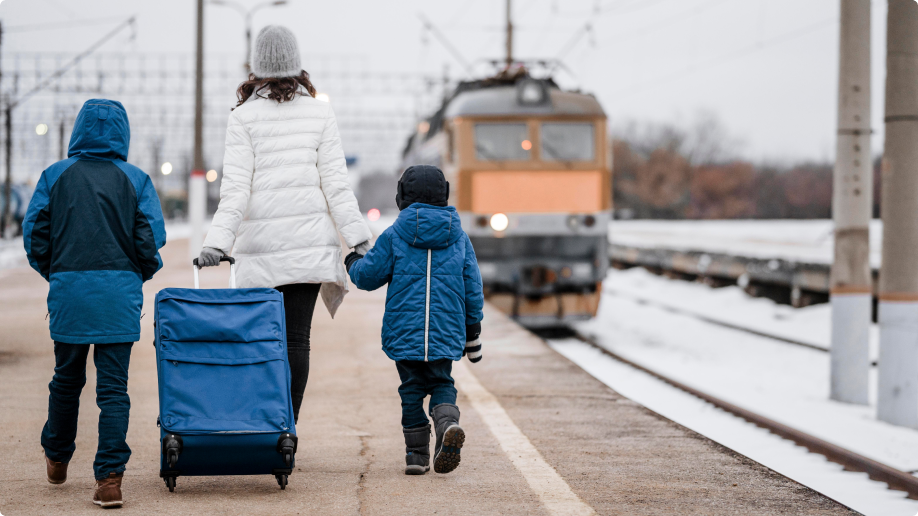 full-shot-kids-woman-train-station 1